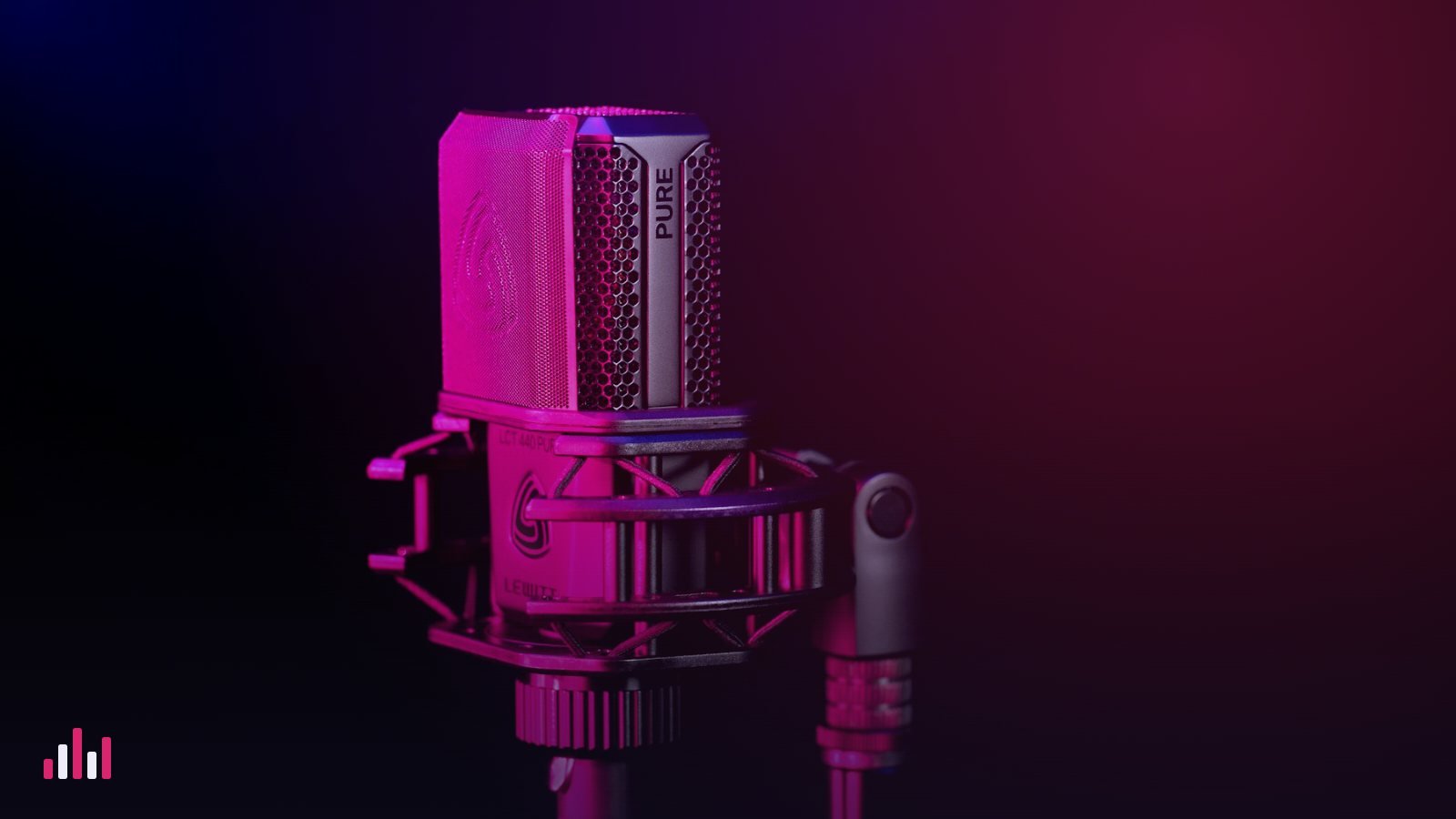 A condenser microphone in a shock mount under pink light