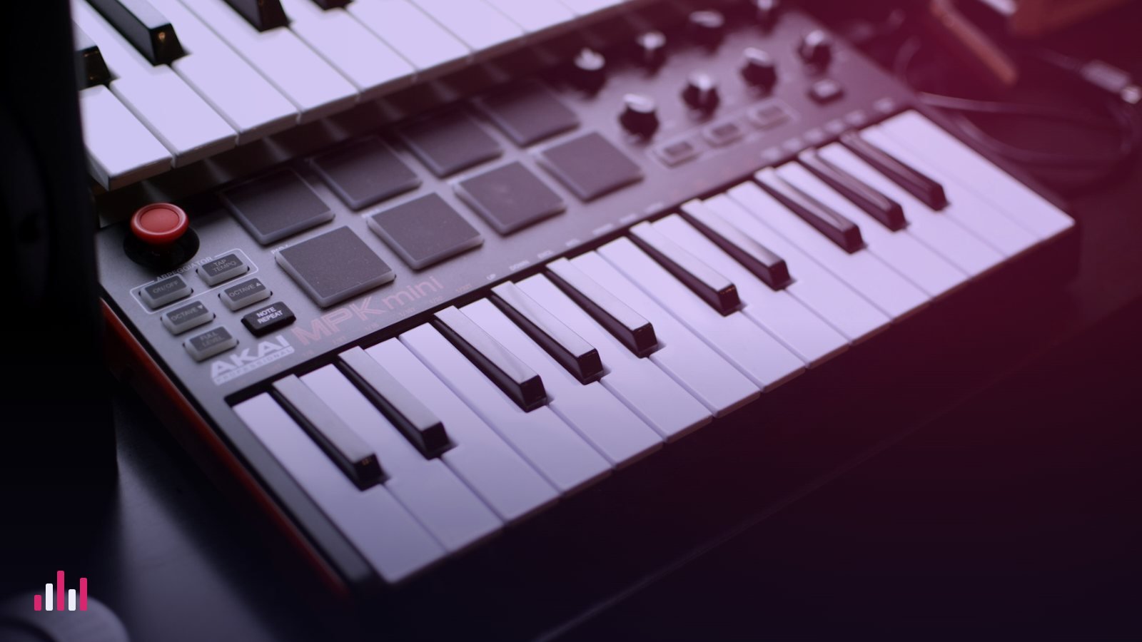 A compact MIDI keyboard controller with drum pads and knobs